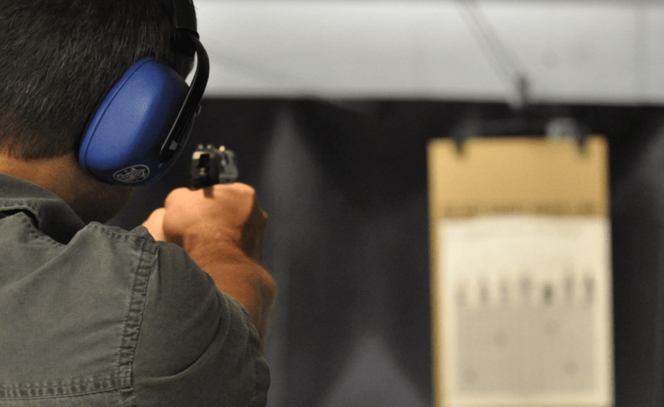 Man at shooting range aims at target--introducing an article about Evangelicalism and militant masculinity