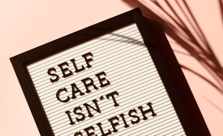 Message board reading "self care isn't selfish"