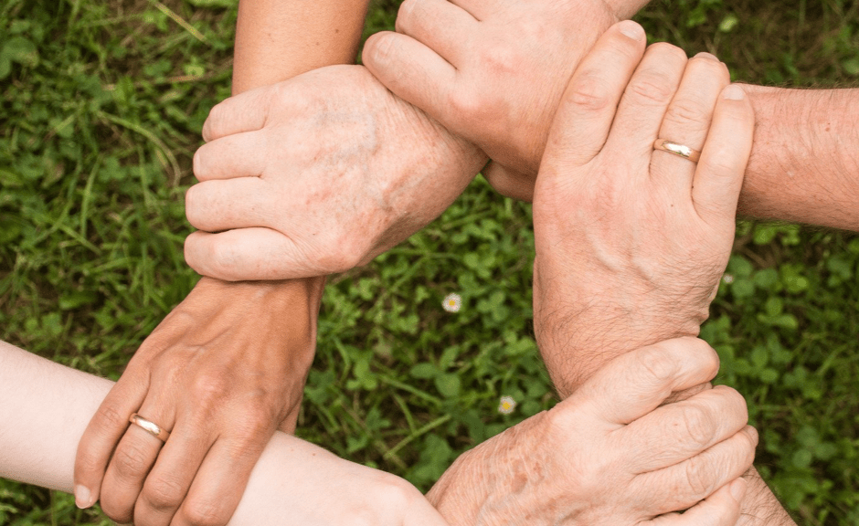 Image showing a mass of handing holding one another in support