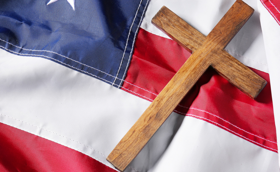 A picture of a US flag and a cross to introduce a piece about the fascistic rhetoric behind unhealthy Christian nationalism