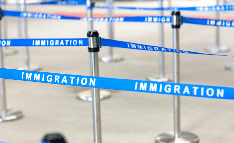 picture of immigration lines at an airport to introduce an article on open borders rhetoric as fascistic rhetoric