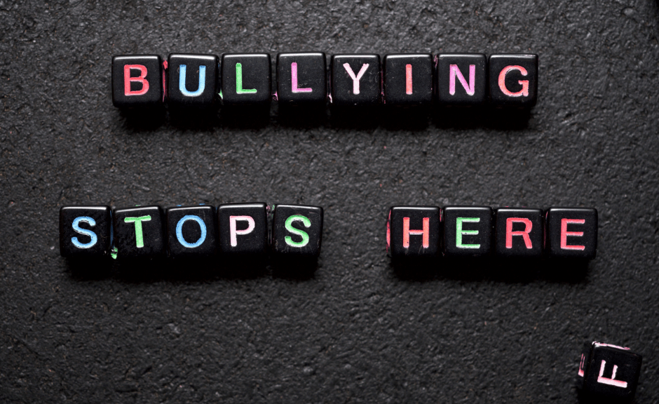 Letters that spell "Bullying Stops Here" to Introduce an article about standing up against bullies in both politics and child abuse