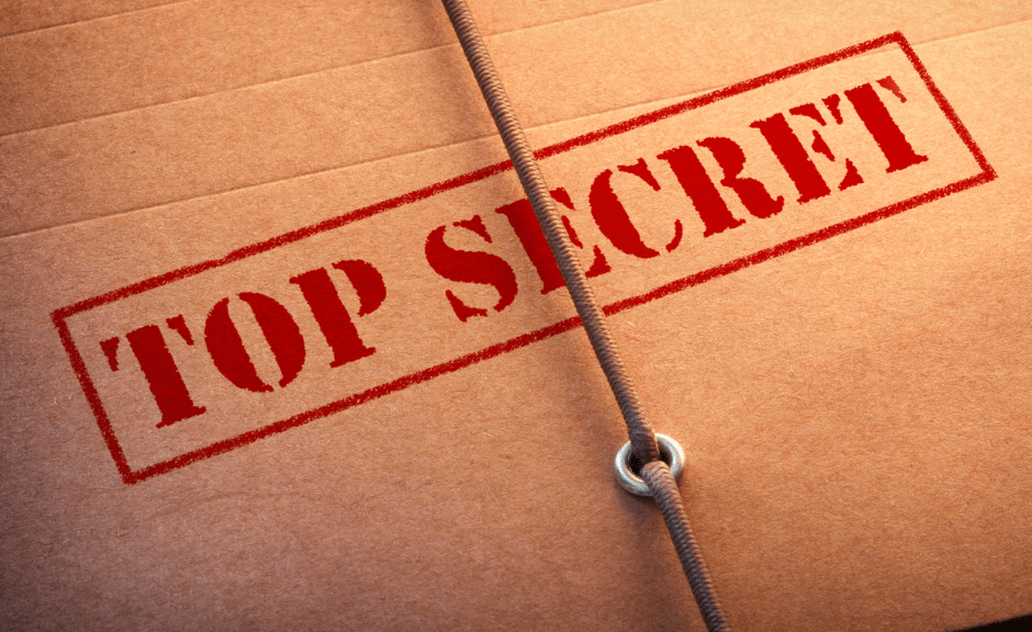 a folder labeled "top secret" to introduce an article on classified documents and sin-leveling