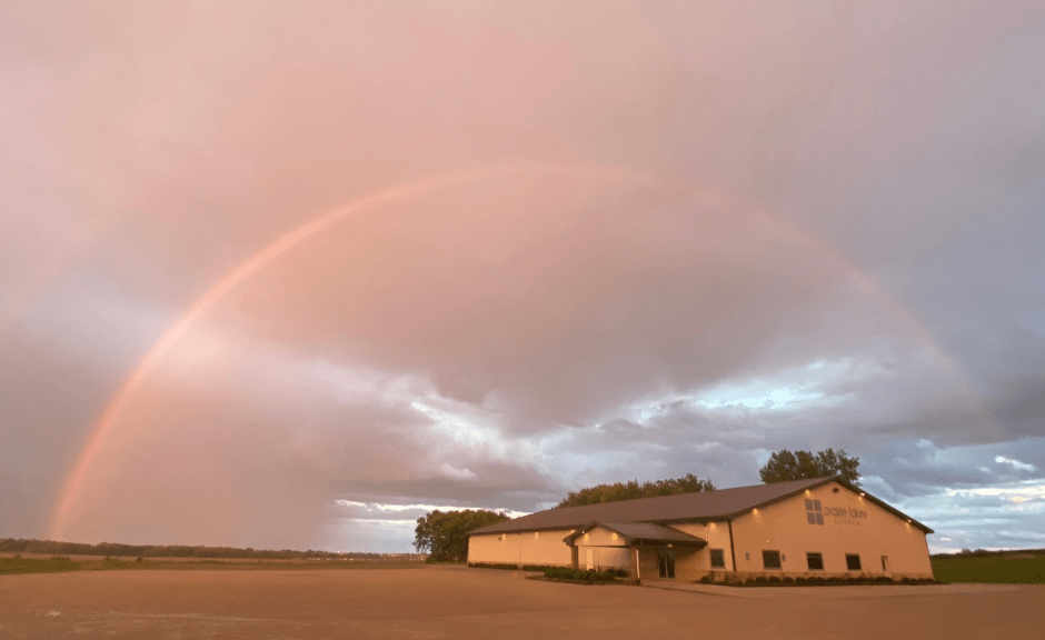 A rainbow over a church (photo by DS Leiter) introduces an article on white Evangelical culture war attempts to control the meaning of the rainbow.